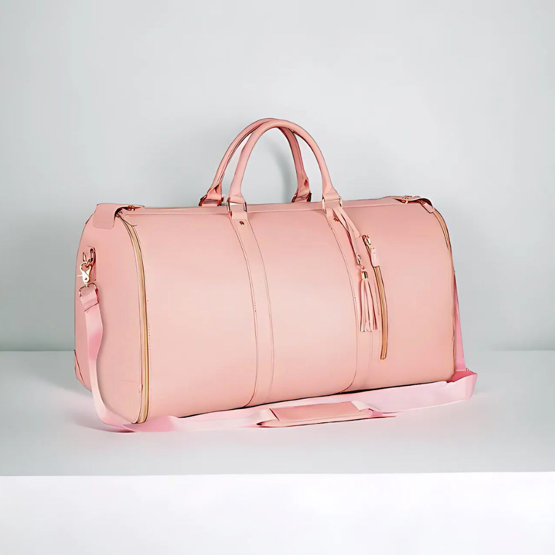 Borsa da viaggio in pelle rosa con dettagli dorati e tracolla regolabile